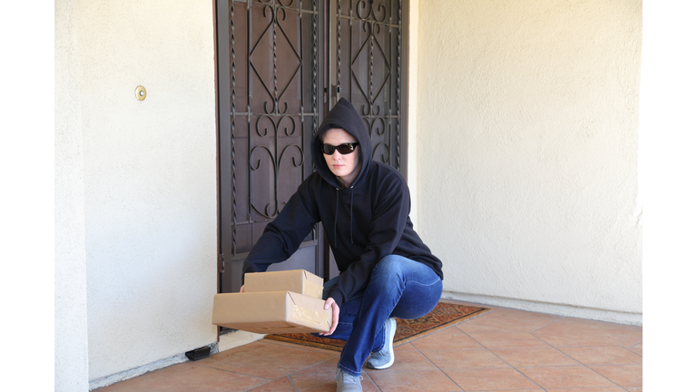 Porch Pirate Woman in Black Hoodie and Sun Glasses Horizontal