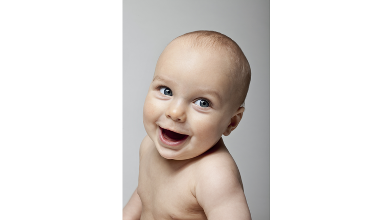 Baby boy smiling, close-up
