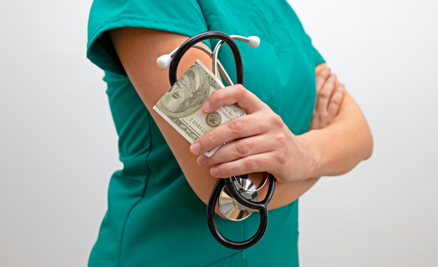 Corrupt female doctor. Nurse with money and stethoscope. The costs of medical services concept.