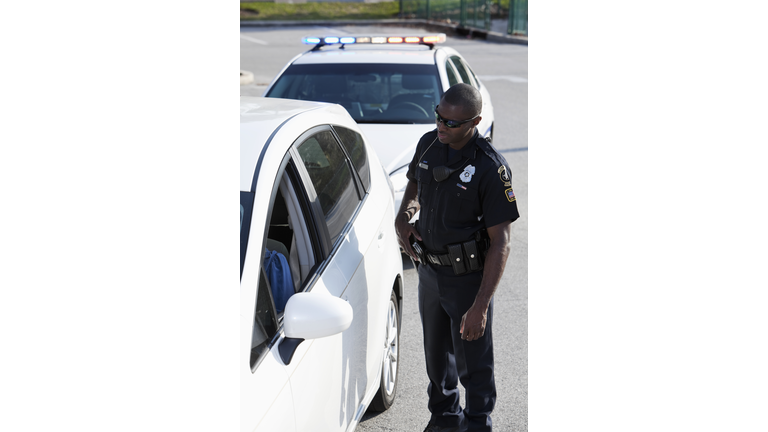 Police officer pulling over driver