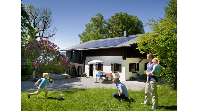 Family at home with solar panel