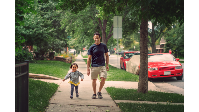 Father Daughter Sidewalk Stroll