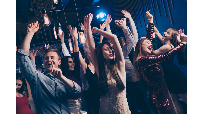 Close up photo of cute charming attractive millennial raise hands concert wear dress shirt free careless carefree feel cheerful content indoors