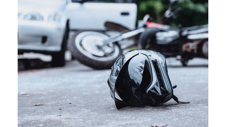 Black biker helmet on street