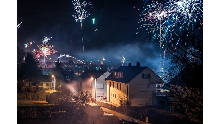 Small village surrounded from fireworks