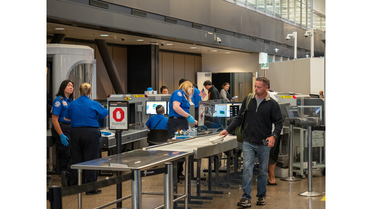 Man passes though Transportation Security Administration TSA security checkpoint at Seattle-Tacoma International Airport