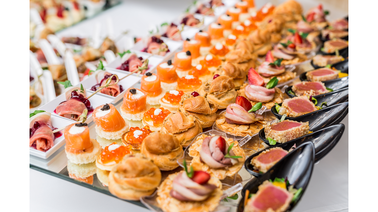 Gourmet appetizers: caviar, venison, tuna and salmon.