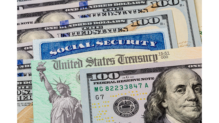 Social Security card, treasury check and 100 dollar bills. Concept of social security benefits payment, retirement and federal government benefits