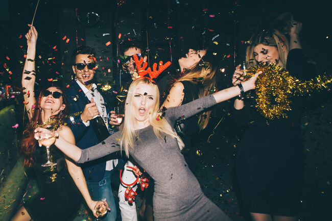 Group of friends having fun in the club