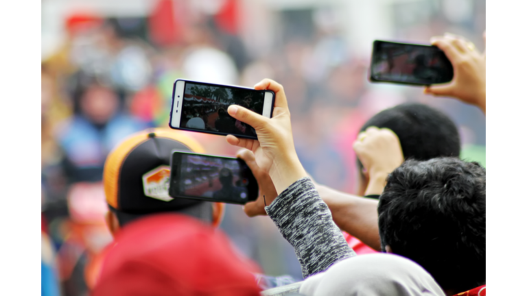 Rear View Of Photographer Photographing