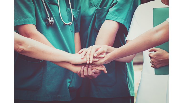 Doctors and nurses coordinate hands. Concept Teamwork