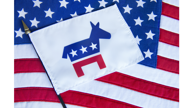 DEMOCRATIC PARTY FLAG with DONKEY as its' SYMBOL laying on an American Flag.