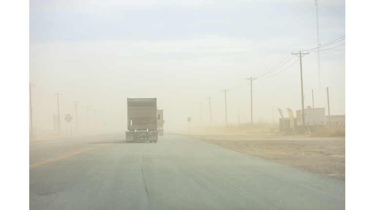 A truck drives through a sand storm near the community of Orla in Reeves County, Texas, USA.