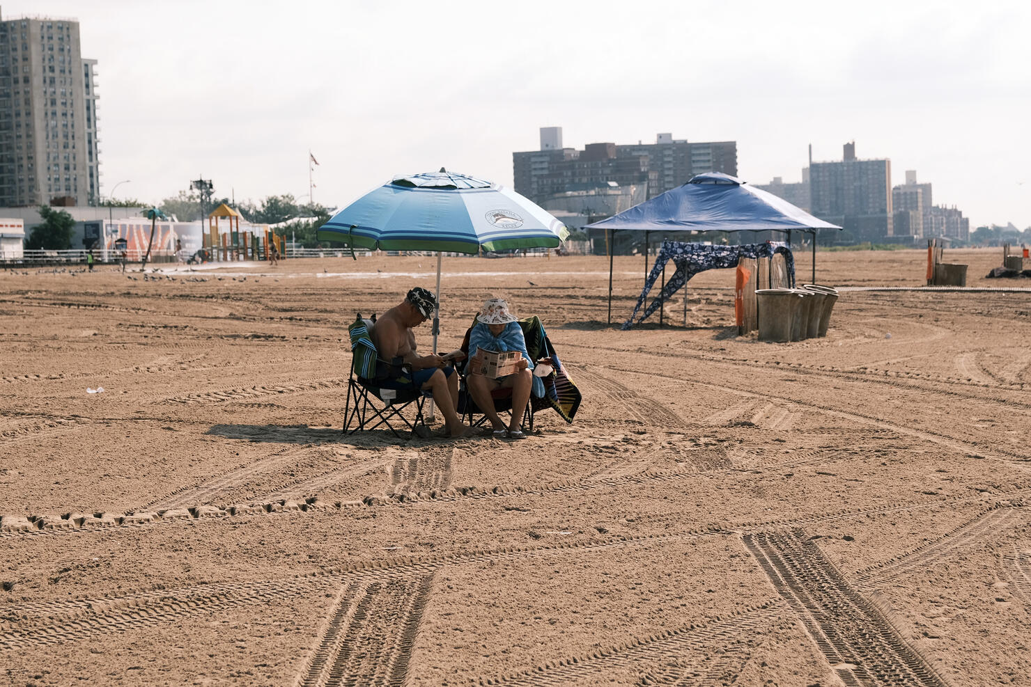 New Yorkers Enjoy The Summer Heat On Coney Island