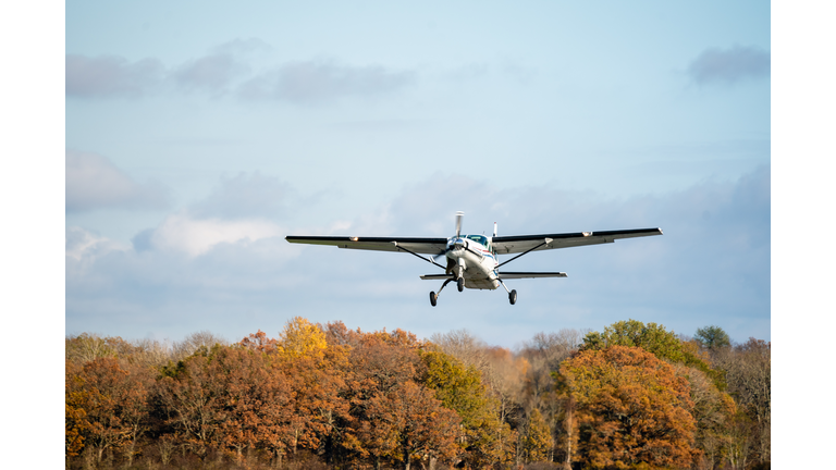 Small airplane taking off from the runway