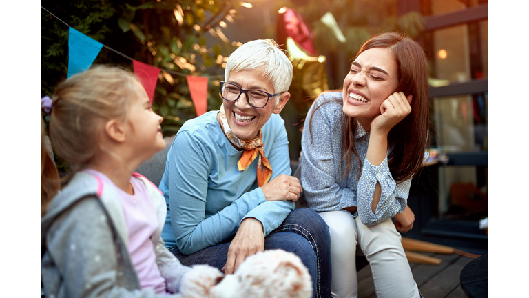 sweet little girl with her mother and grandmother. Three generation concept