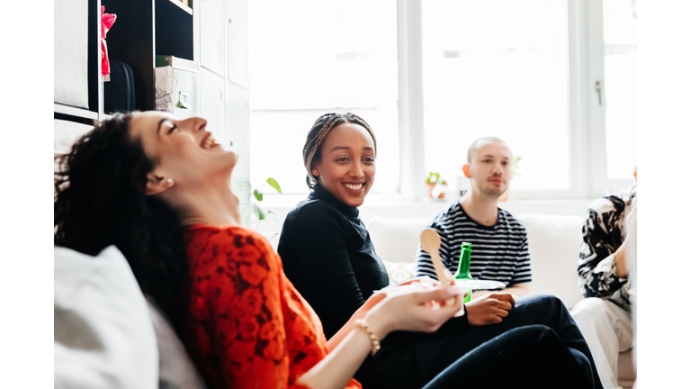 Office Workmates Socializing With Drinks In Office