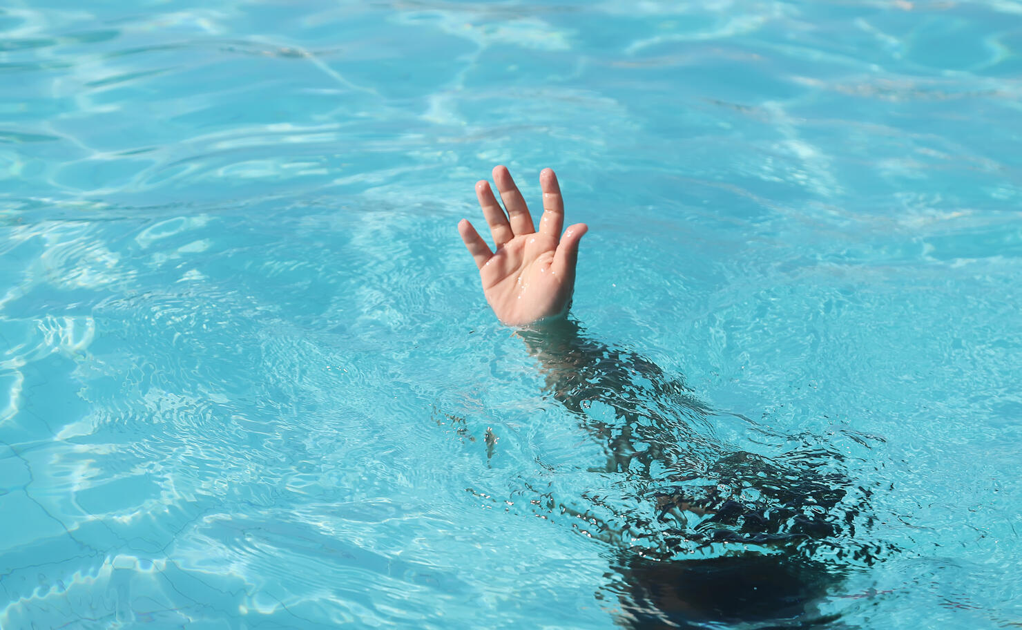 Girl drowning in swimming pool