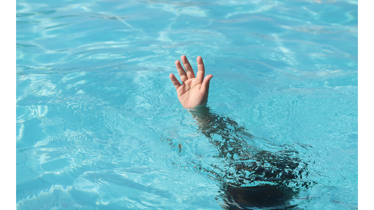 Girl drowning in swimming pool