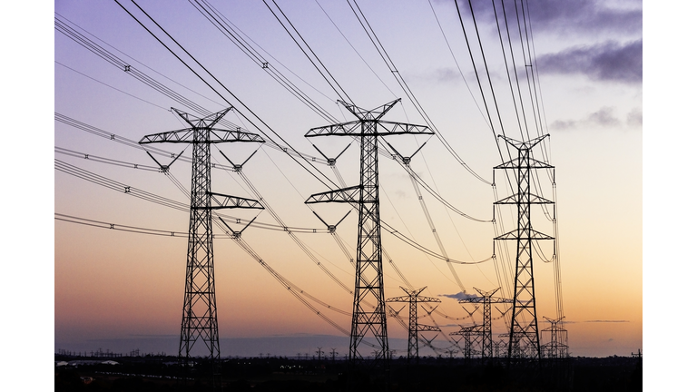 Electricity Pylons During Dusk Evening Sky Sunset