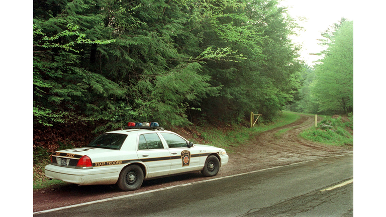 A Pennsylvania State Police Trooper guards the ent