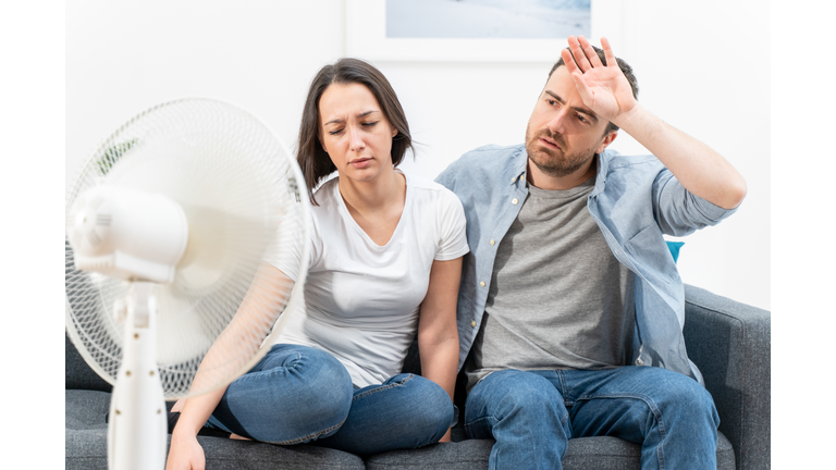 Couple feeling bad at home after summer heat