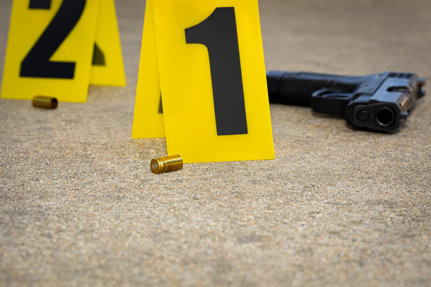 Gun shell casing at crime scene. Gun violence, mass shooting and homicide investigation concept.
