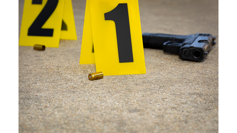 Gun shell casing at crime scene. Gun violence, mass shooting and homicide investigation concept.