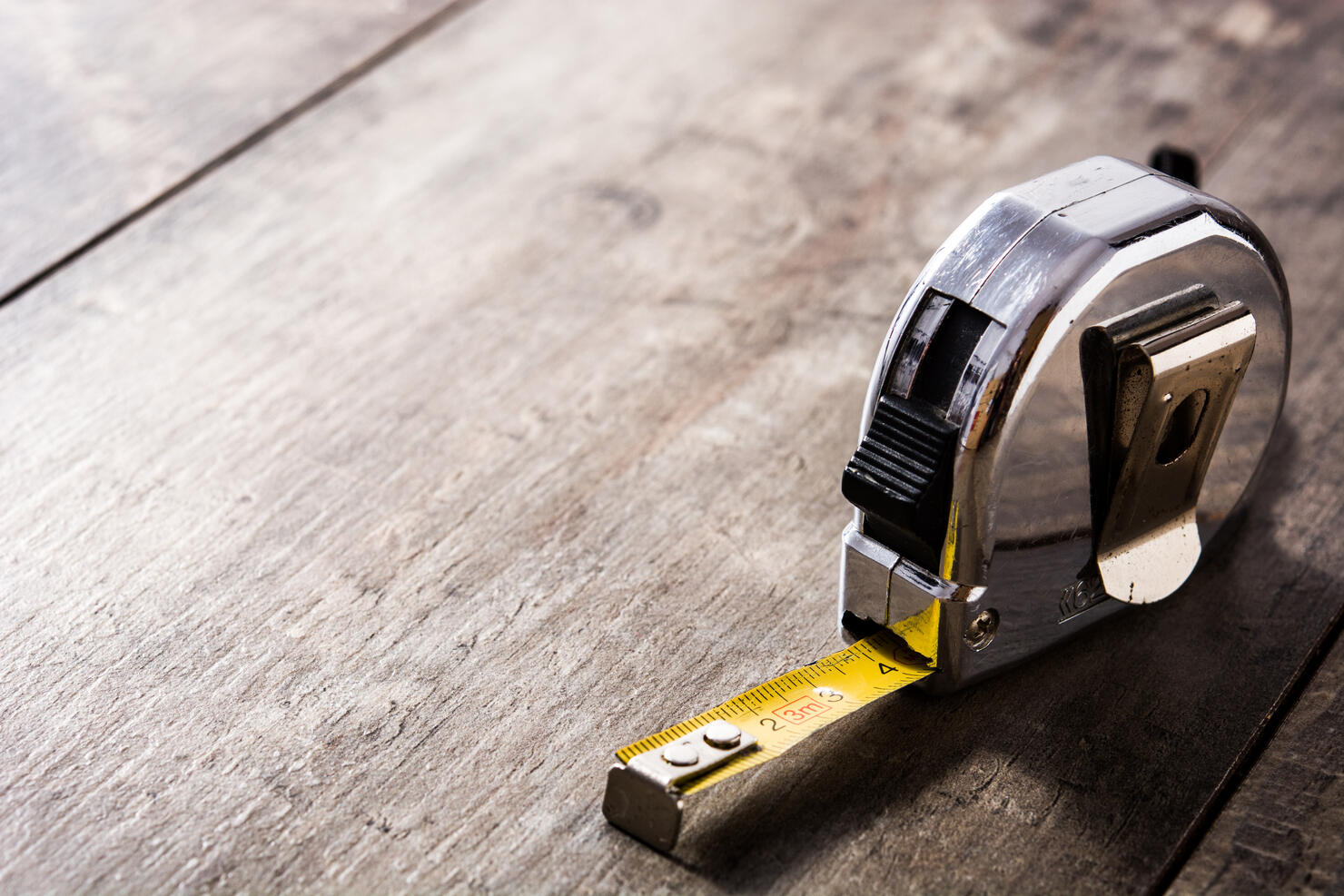 Measuring tape on wooden table