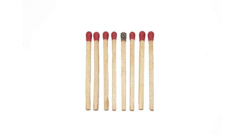 Close-Up Of Matchsticks Against White Background