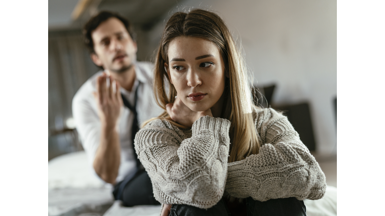 Angry man is yelling at his wife.