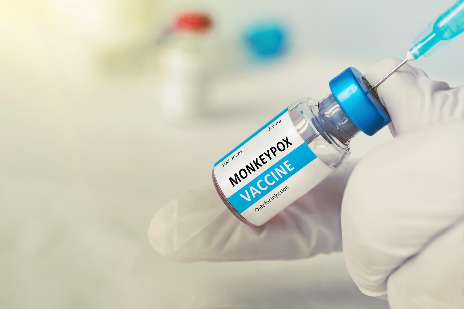Vaccination for booster shot for Smallpox and Monkeypox MPXV . Doctor with vial of roses vaccine for Monkeypox disease