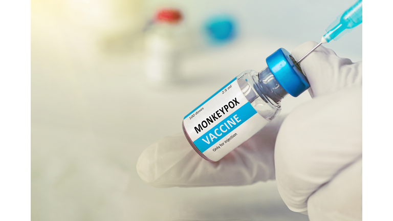 Vaccination for booster shot for Smallpox and Monkeypox MPXV . Doctor with vial of roses vaccine for Monkeypox disease