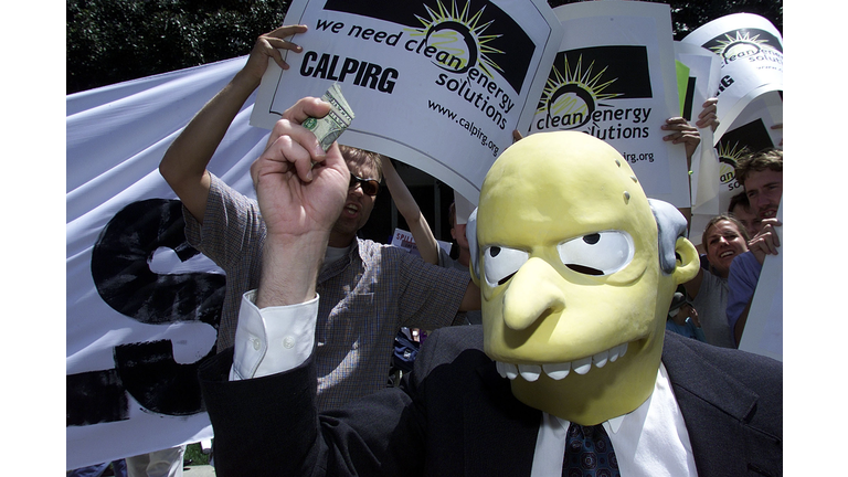 A demonstrator impersonating "Mr. Burns" from the