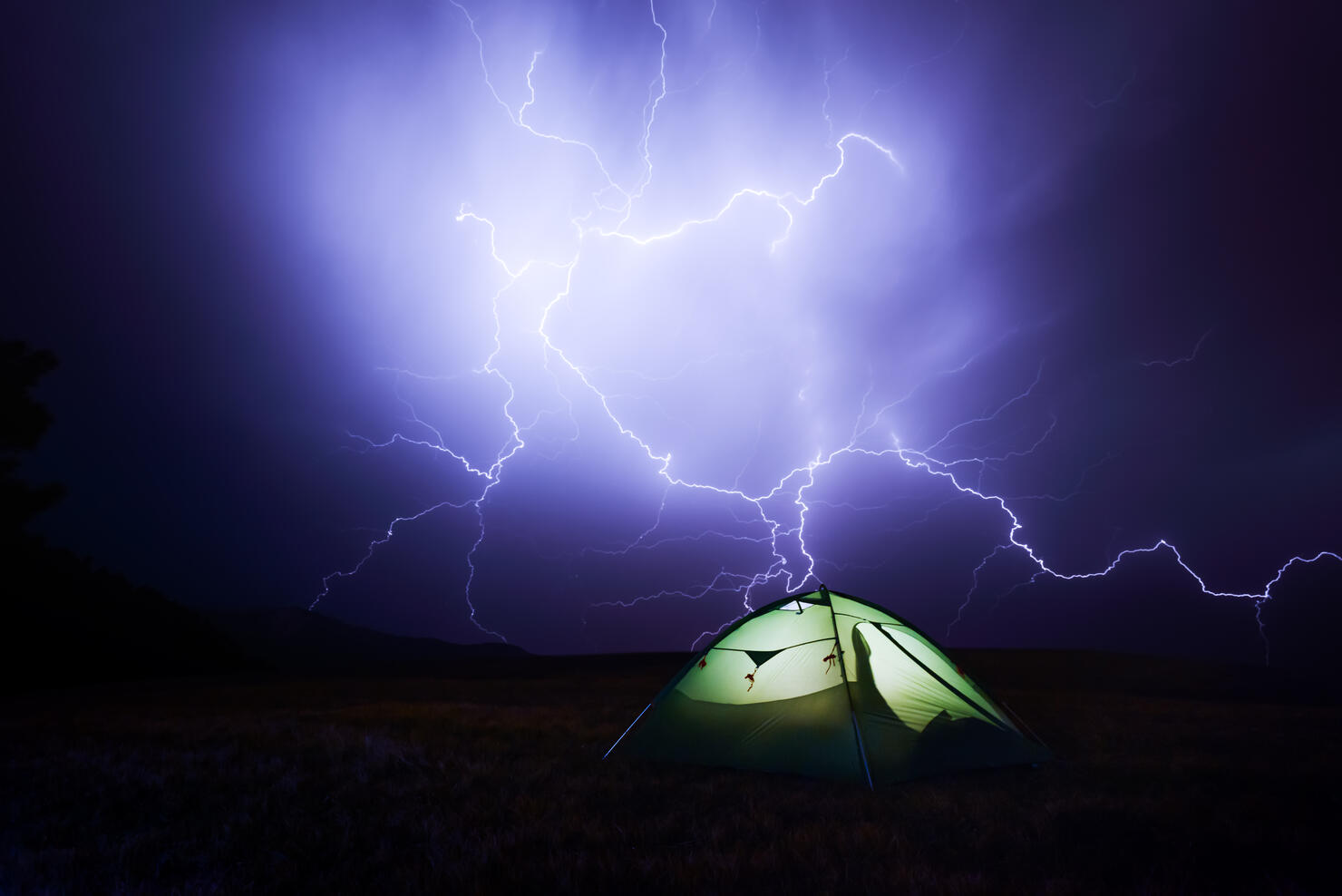Incredible sky with lightning and tent