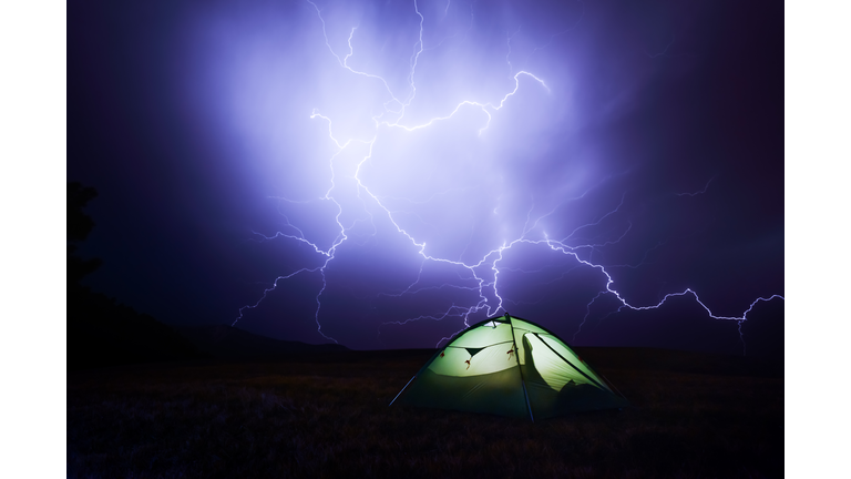 Incredible sky with lightning and tent