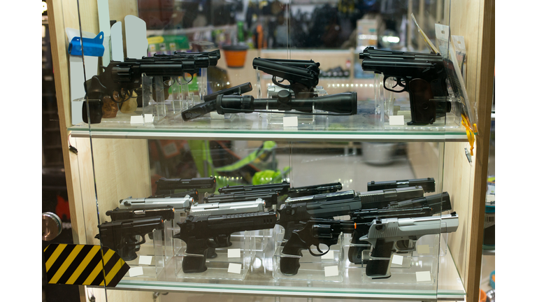 Showcase with traumatic weapons in the store