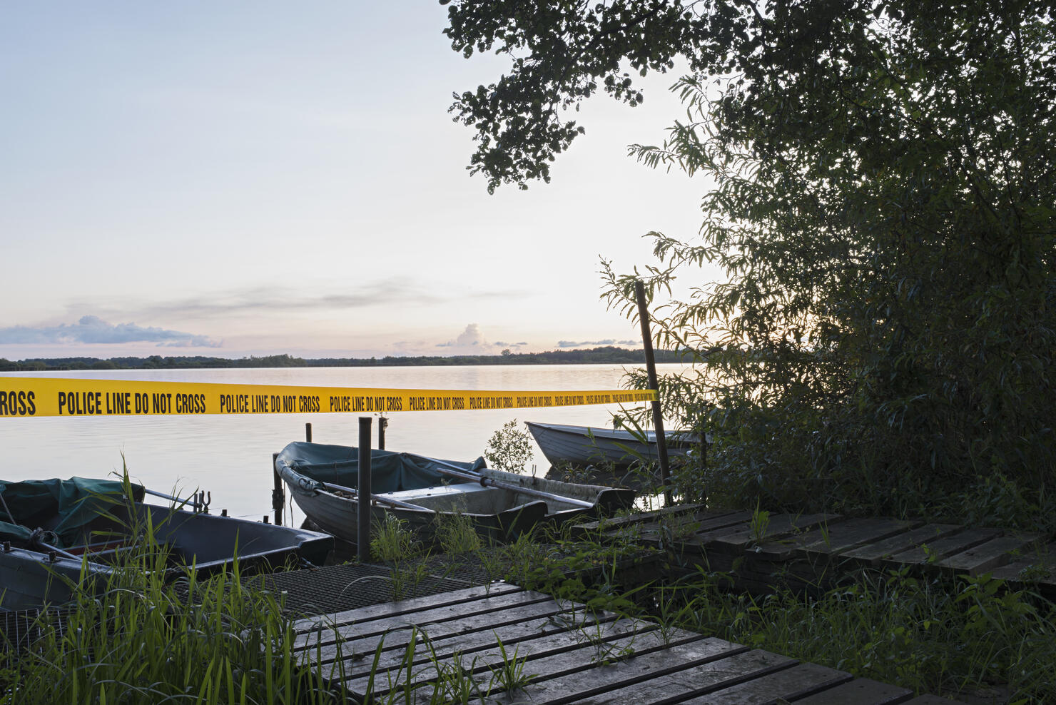 crime scene at a lake in the evening