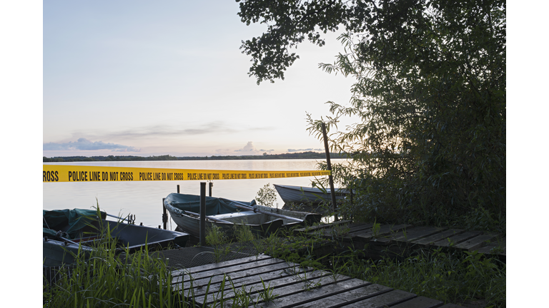 crime scene at a lake in the evening