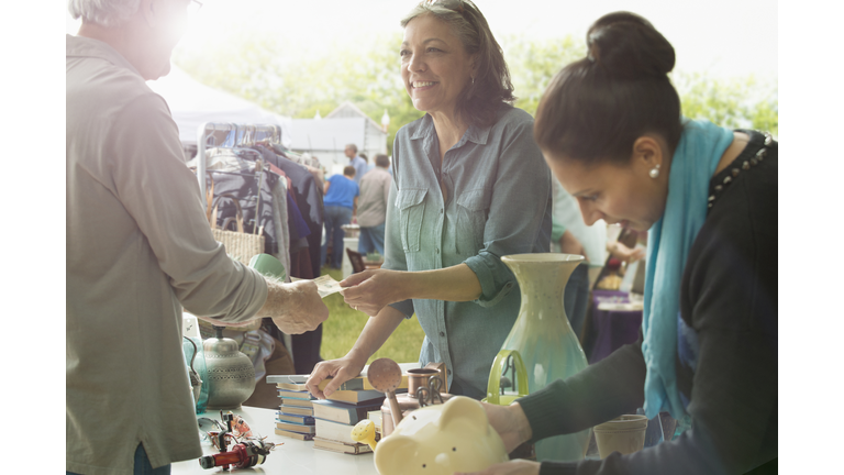 Hispanic women shopping at flea market