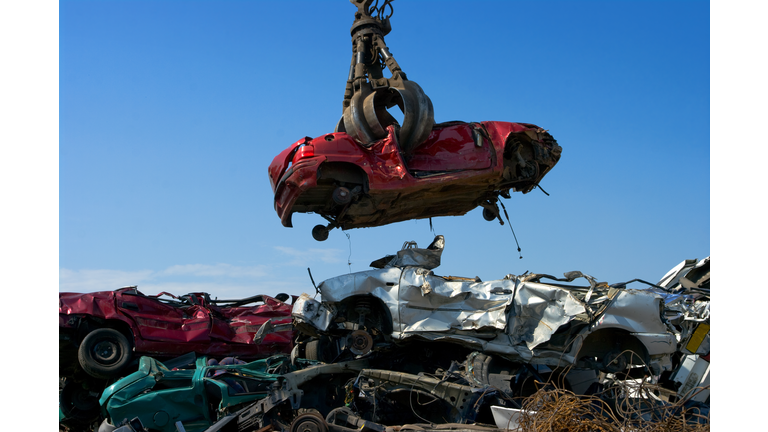 Crane picking up car