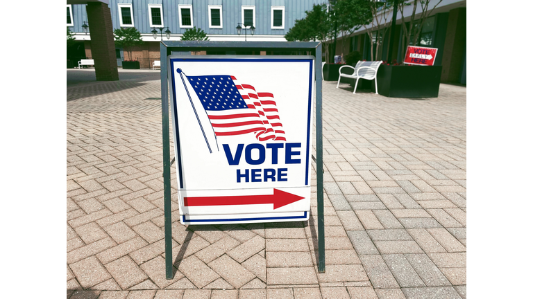 “Vote Here” Directional Sign Outside of Polling Place