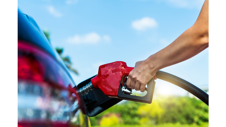 Woman hand refuelling the car