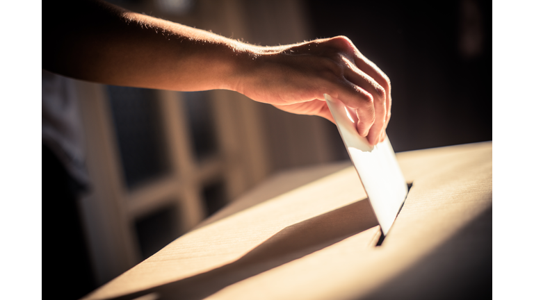 Conceptual image of a person voting during elections