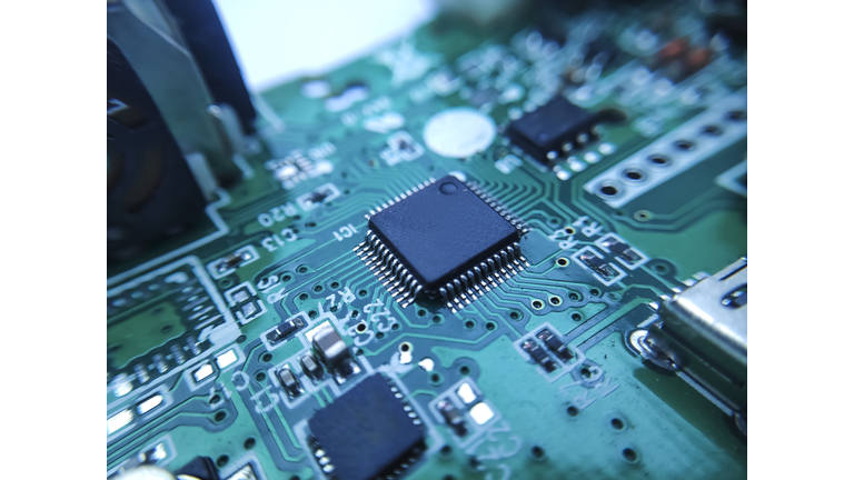 Close up image of microchip. Integrated circuit IC macro photograph.