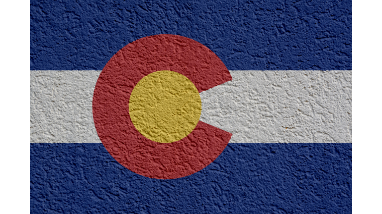 US State Politics Or Business Concept: Colorado Flag Wall With Plaster, Texture