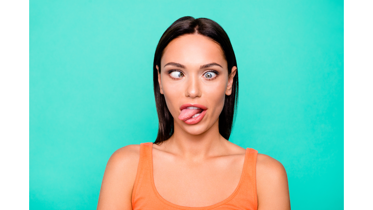 Close up photo portrait of funny funky playing fool making faces she her girl sticking tongue out watching in different ways isolated pastel background