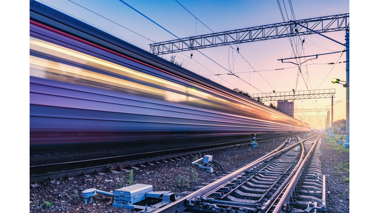 Two trains move fast to the different directions.