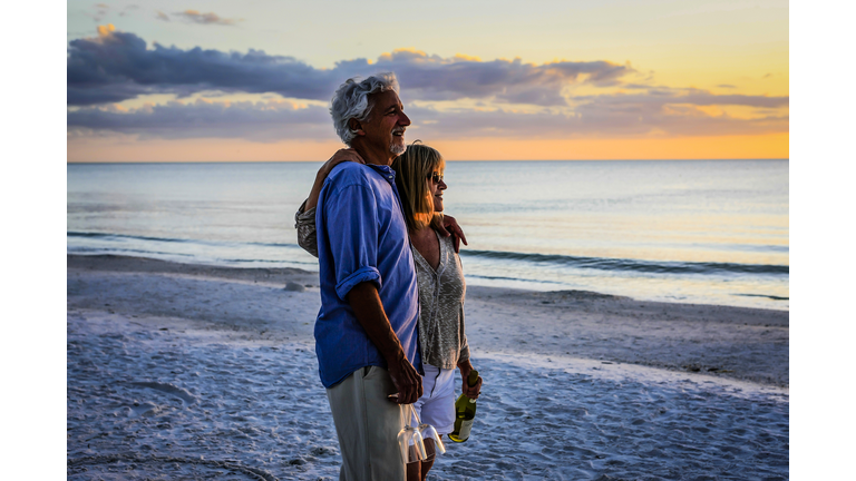 Active retirees enjoy the sunset on Siesta Key beach FL