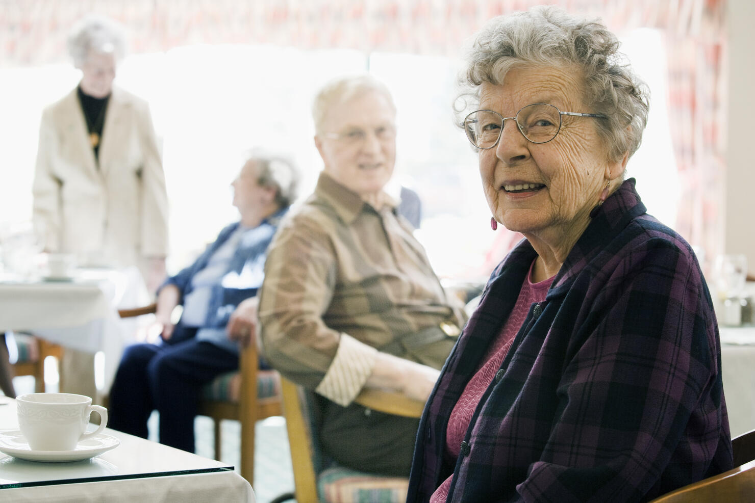 Elderly Woman in Nursing Home Drinking Coffee